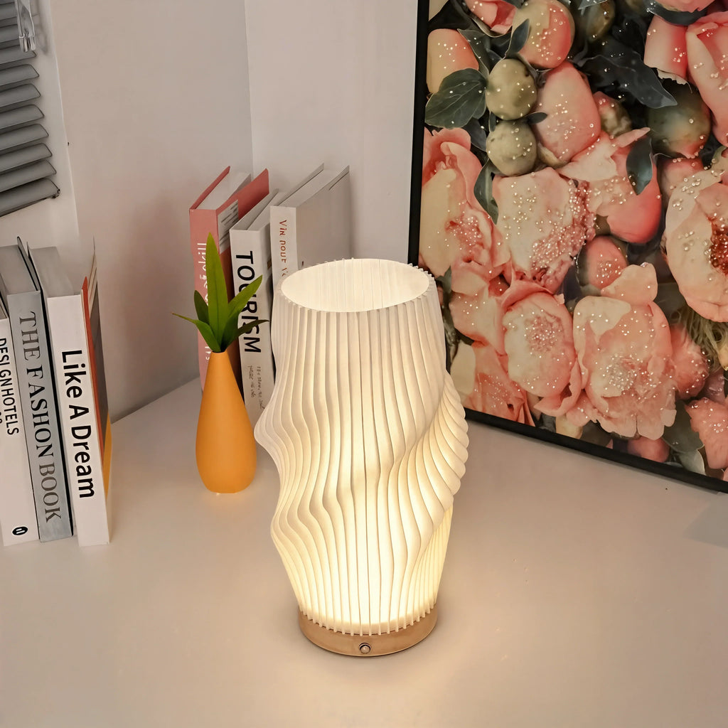 Velo LED Desk Lamp With Sculpted Form And Warm Ambient Glow
