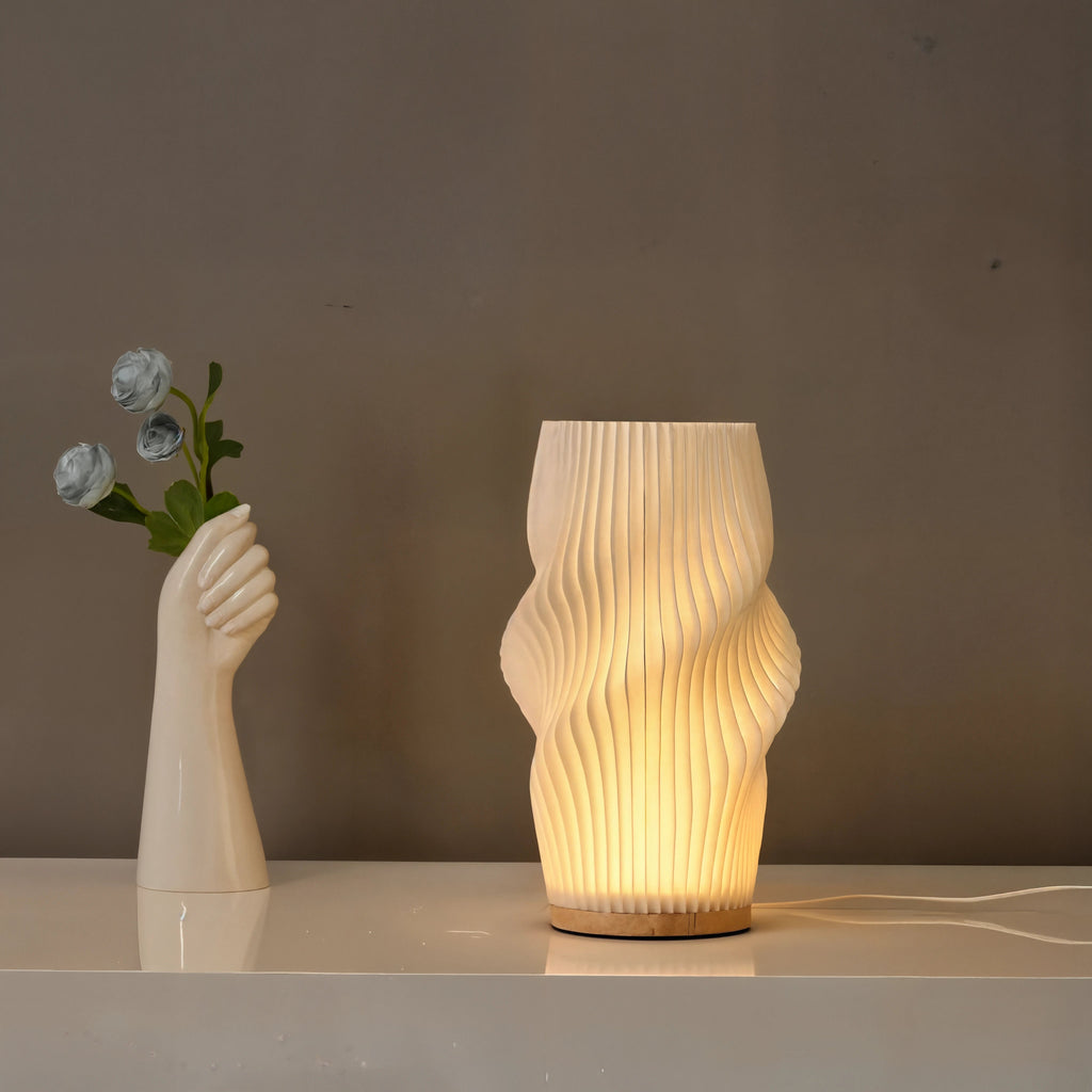 Velo LED Desk Lamp With Sculpted Form And Warm Ambient Glow